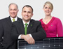 photo of TD employees holding a solar panel