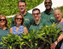photo of TD employees holding plants