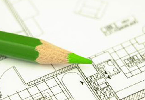 image of green pencil on building plans